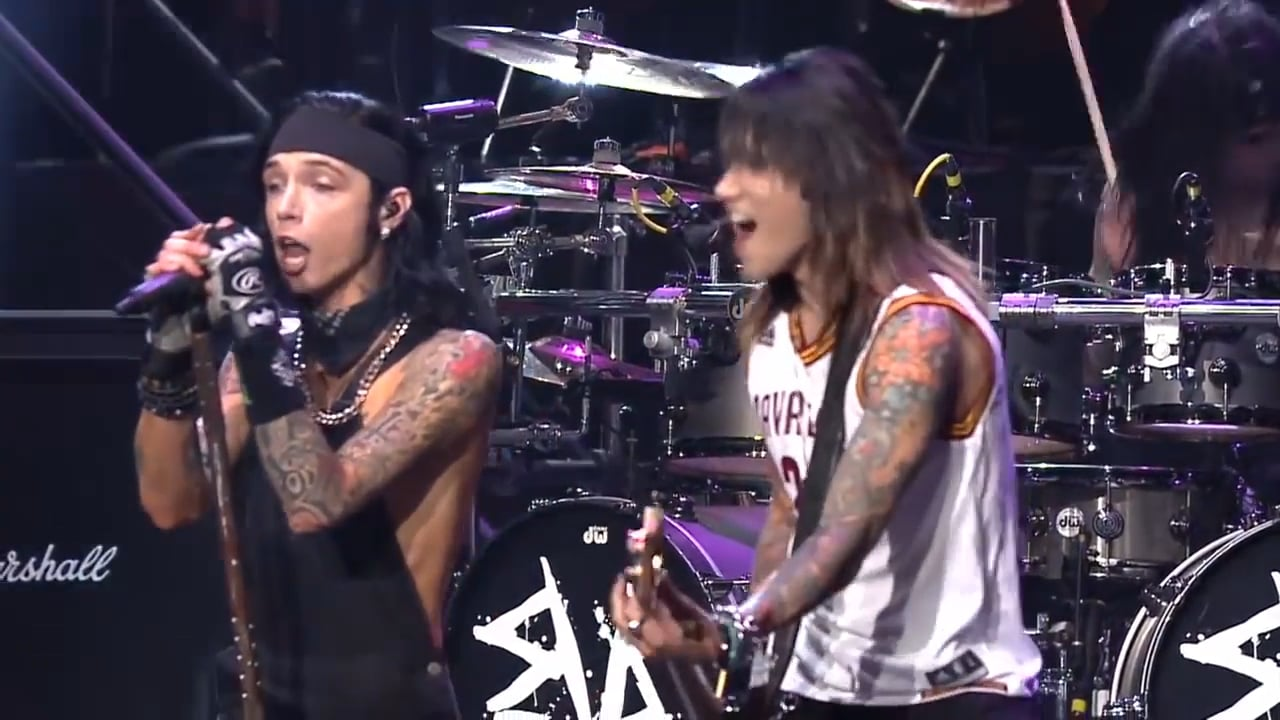 Members of Black Veil Brides perform Faithless live with the Contemporary Youth Orchestra at the Alternative Press Music Awards, combining rock and orchestral elements on stage.
